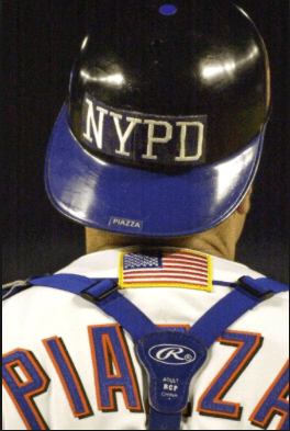 Photo courtesy of the New York Daily News. New York Mets catcher and Hall of Famer Mike Piazza dons an NYPD helmet on 9/21/11.