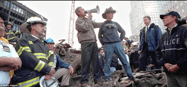 Former Presient George Bush gives a meaningful speech atop the rubble at Ground Zero in Manhattan. Police, firemen, first responders, and the entire world looked on.