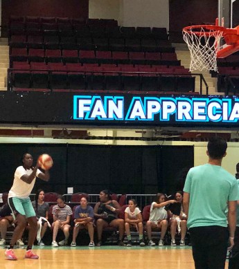 Liberty's Tina Charles drains a shot during warm ups on fan appreciation day at Westchester County Center.